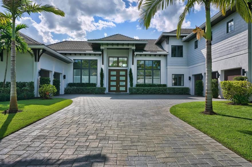Stunning Custom-Built totally private estate home sits on 1.27 acres in Jupiter east of I95. The main living quarters has the master suite, dream gourmet custom kitchen with Thermador appliances, pantry,  guest suite, office, dining room, possible 6th bedroom or nursery.  Over 1100 square foot attached living quarters/ media center with separate covered entrance, a full cabana bath and attached 2 and 3 car garages. Upstairs living has 3 full bedroom suites with solid marble baths and huge walk-in closets, additional office/ bonus room and a wet bar with refrigerator. Large 10' tall by 8' wide custom solid double mahogany entry doors and transoms. All exterior soffits/corbels/brackets/overhangs/ are stained solid cypress wood. Kolbe & Kolbe wood clad hurricane impact windows and