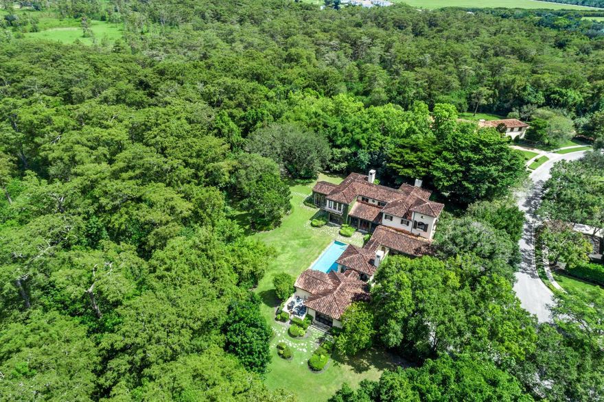 This exceptional residential estate comprises one of the largest lots  (1.15 acres) and is one of only 3 homes in the exclusive Bridle Path neighborhood of Palm Beach Polo to abut the Big Blue Cypress Forest preserve area, offering the utmost in privacy and natural beauty. Extensive landscaping improvements were completed that provide incredible privacy, beauty and unparalleled viewsheds of and into Palm Beach Polo's protected Big Blue Cypress Preserve area.