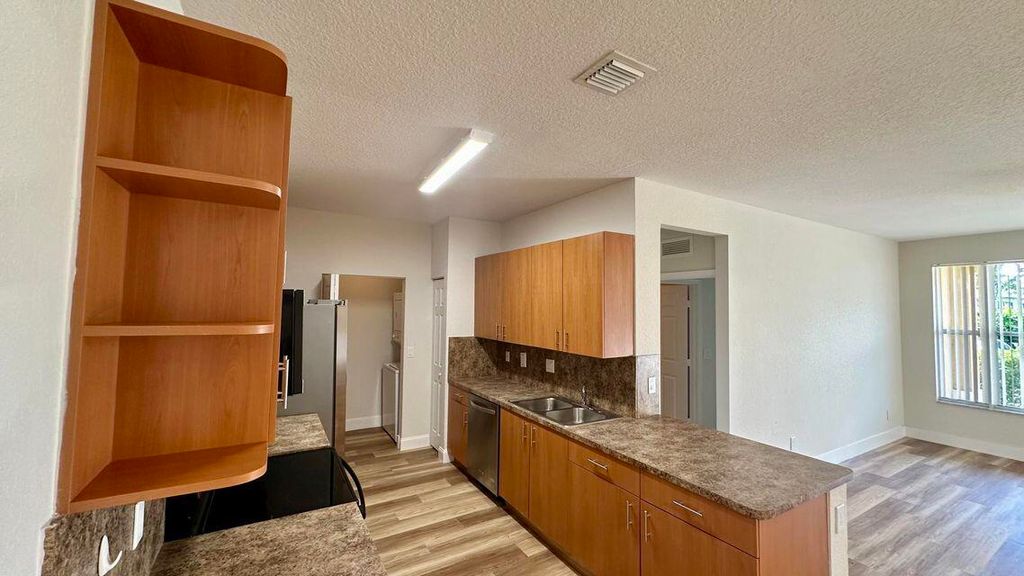 Photo of 3545 Forest Hill Boulevard #5, Palm Springs, FL 33406 (MLS # R11080630)