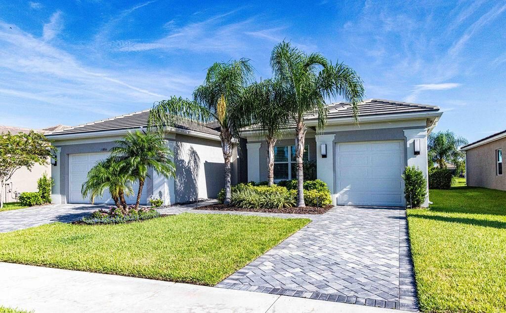 Photo of 11886 SW Sailfish Isles Way, Port St Lucie, FL 34987 (MLS # R10909129)