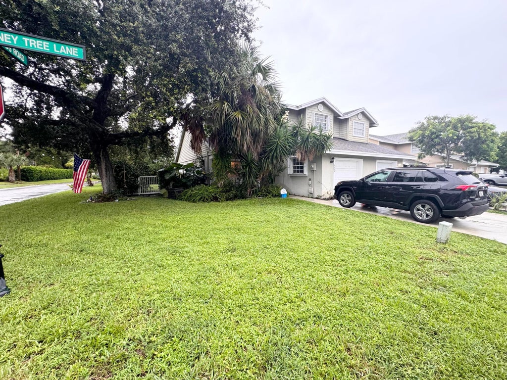 Photo of 949 Honeytree Lane #A, Wellington, FL 33414 (MLS # B26078117)