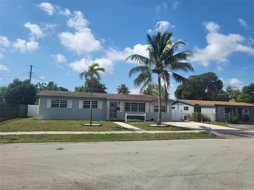 Beautiful house freshly painted grey with white baseboards. Tiled throughout. Kitchen with granite counters and breakfast bar. Dining area off the kitchen.  Florida room with fireplace. Family room. Laundry room. Ceiling fans throughout. Bathroom with double sinks, tub and shower. Master bathroom with shower only. Accordion shutters. Fenced yard. Nicely landscaped with rock garden.  Close to the Hard Rock stadium. Lots more!  Don't miss it!