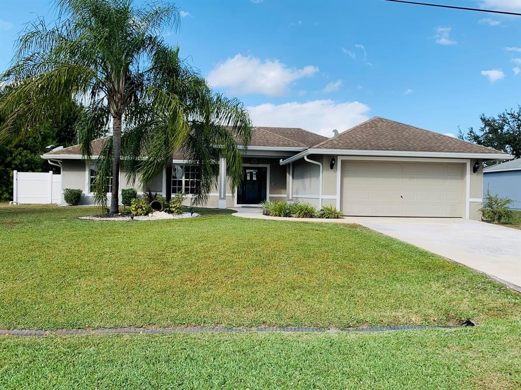 Photo of 541 SW Feldman Avenue, Port Saint Lucie, FL 34953 (MLS # R10768067)