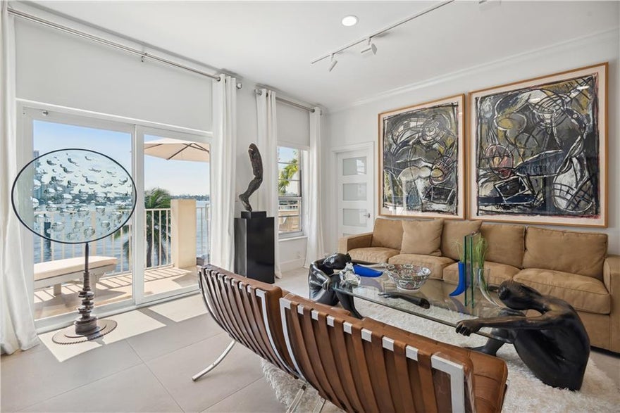 A condo with NO RENTAL RESTRICTIONS. Stunning direct Intracoastal views, impeccably designed and decorated with a modern open kitchen, porcelain floors and higher ceilings. A balcony facing SW on the peaceful side of a mid-century modern boutique tropical paradise hidden away in the heart of Fort Lauderdale Beach. 37 Residences with only five 2 bedrooms. Perfect to use some of the time and maximize the rental opportunity or for a 1031 Exchange. Only one block to the beach and across from the 'W' hotel, Four Seasons, trendy Breakers Ave with outdoor cafes, #1 bakery and boutique shops. ALL utilities & cable TV are included in the maintenance fees and comes with a deep covered parking space with room for 2 cars & electric charging. Small dog friendly and a Non-Smoking complex.