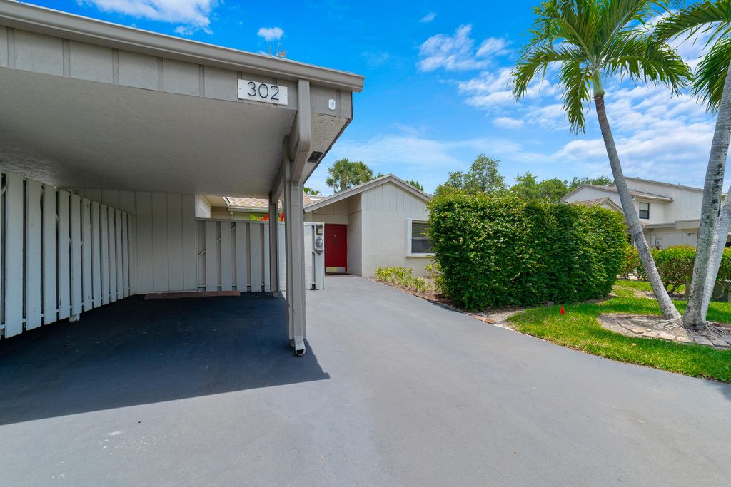 Photo of 302 Deer Creek Wildwood Lane E, Deerfield Beach, FL 33442 (MLS # B26031229)