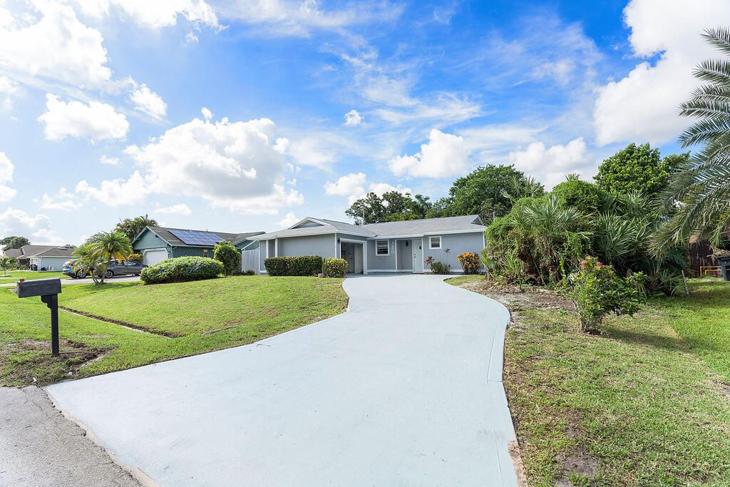 Photo of 1450 SW Cellini Avenue, Port Saint Lucie, FL 34953 (MLS # R11007839)