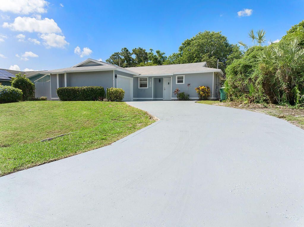 Photo of 1450 SW Cellini Avenue, Port Saint Lucie, FL 34953 (MLS # R11007839)