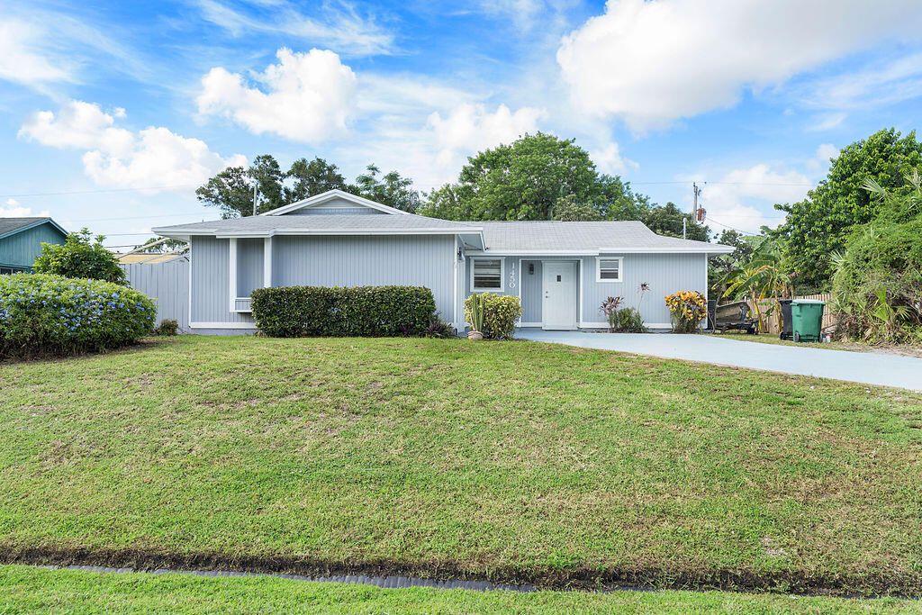 Photo of 1450 SW Cellini Avenue, Port Saint Lucie, FL 34953 (MLS # R11007839)