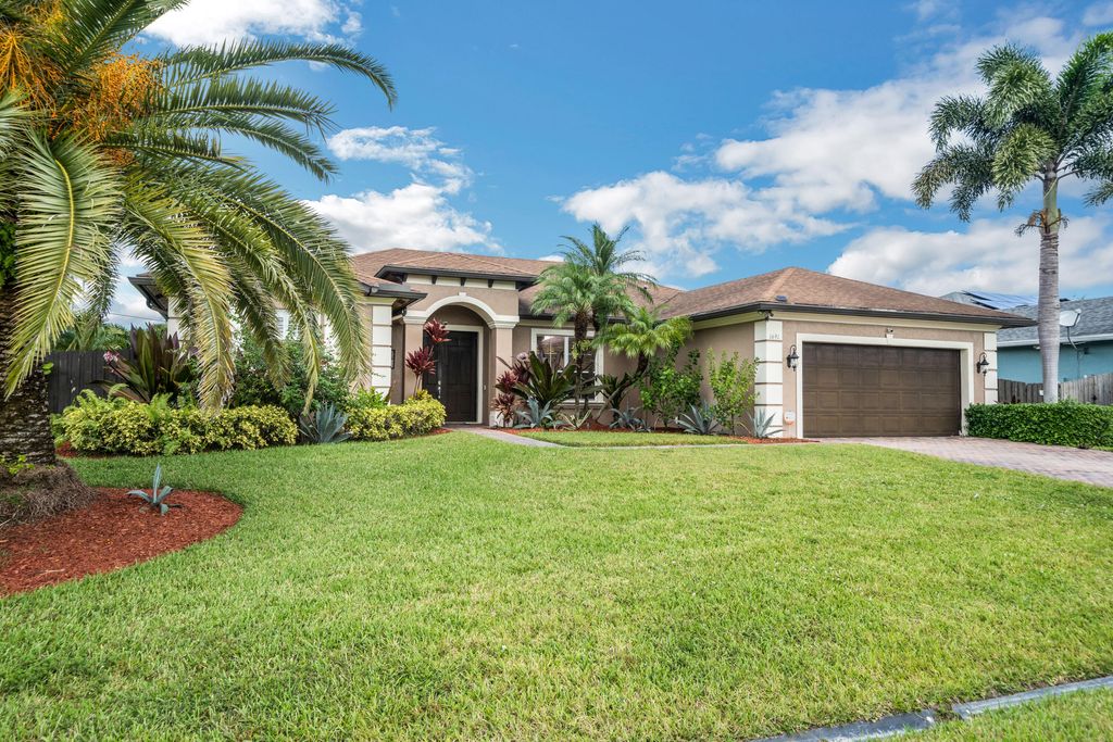 Photo of 1691 SW Crawford Avenue, Port Saint Lucie, FL 34953 (MLS # B26028436)