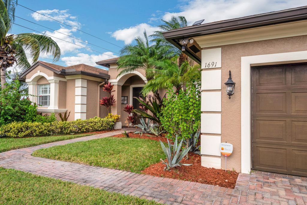 Photo of 1691 SW Crawford Avenue, Port Saint Lucie, FL 34953 (MLS # B26028436)