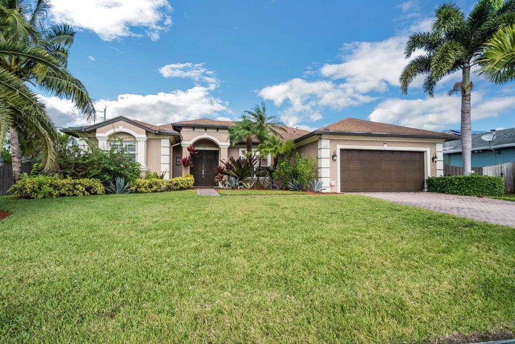 Photo of 1691 SW Crawford Avenue, Port Saint Lucie, FL 34953 (MLS # B26028436)