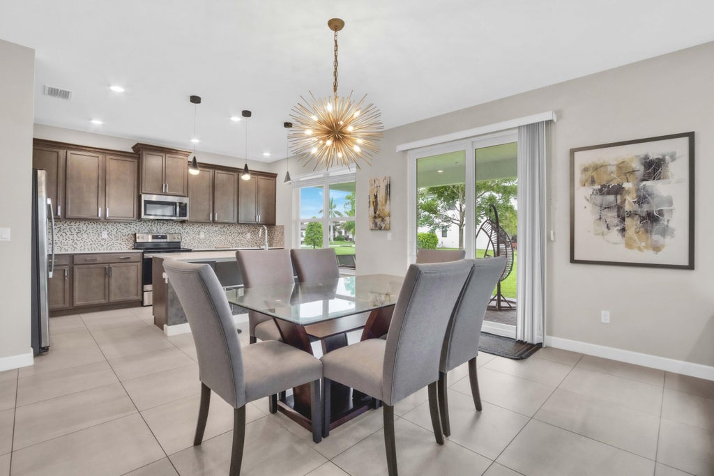 Photo of 1304 Whitcombe Drive, Royal Palm Beach, FL 33411 (MLS # B26058997)