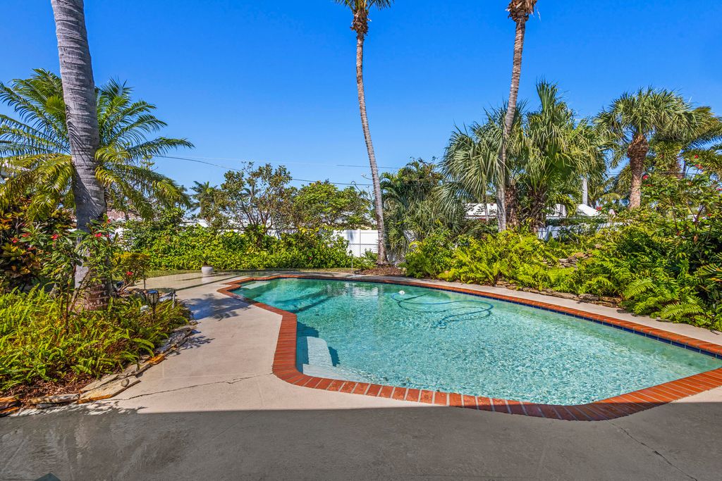 Photo of 309 Claremont Lane, Palm Beach Shores, FL 33404 (MLS # R10962654)