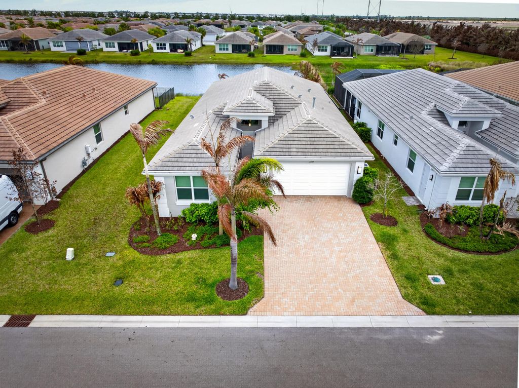 Photo of 11949 SW Coral Cove Parkway, Port Saint Lucie, FL 34987 (MLS # B26021168)
