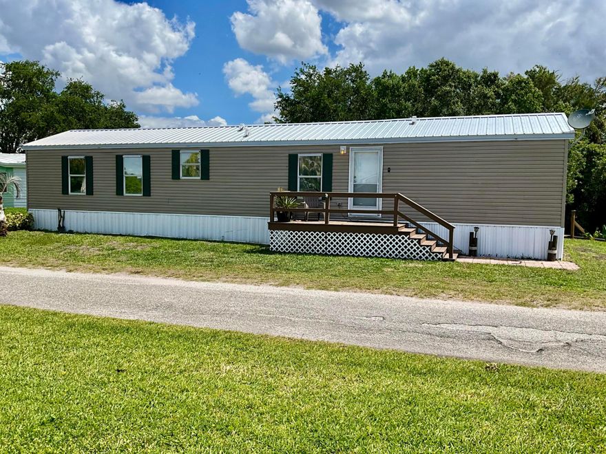 Charming single wide manufactured home nestled on a quiet canal with direct access to the lake. This 2 bedroom 2 bathroom property offers peaceful setting on a low traffic road, perfect for those seeking privacy and a relaxed lifestyle. Enjoy serene water views, easy boating access, and the opportunity to make this home your own retreat. Ideal as full time residence or a get away! Texting listing agent for showing details.