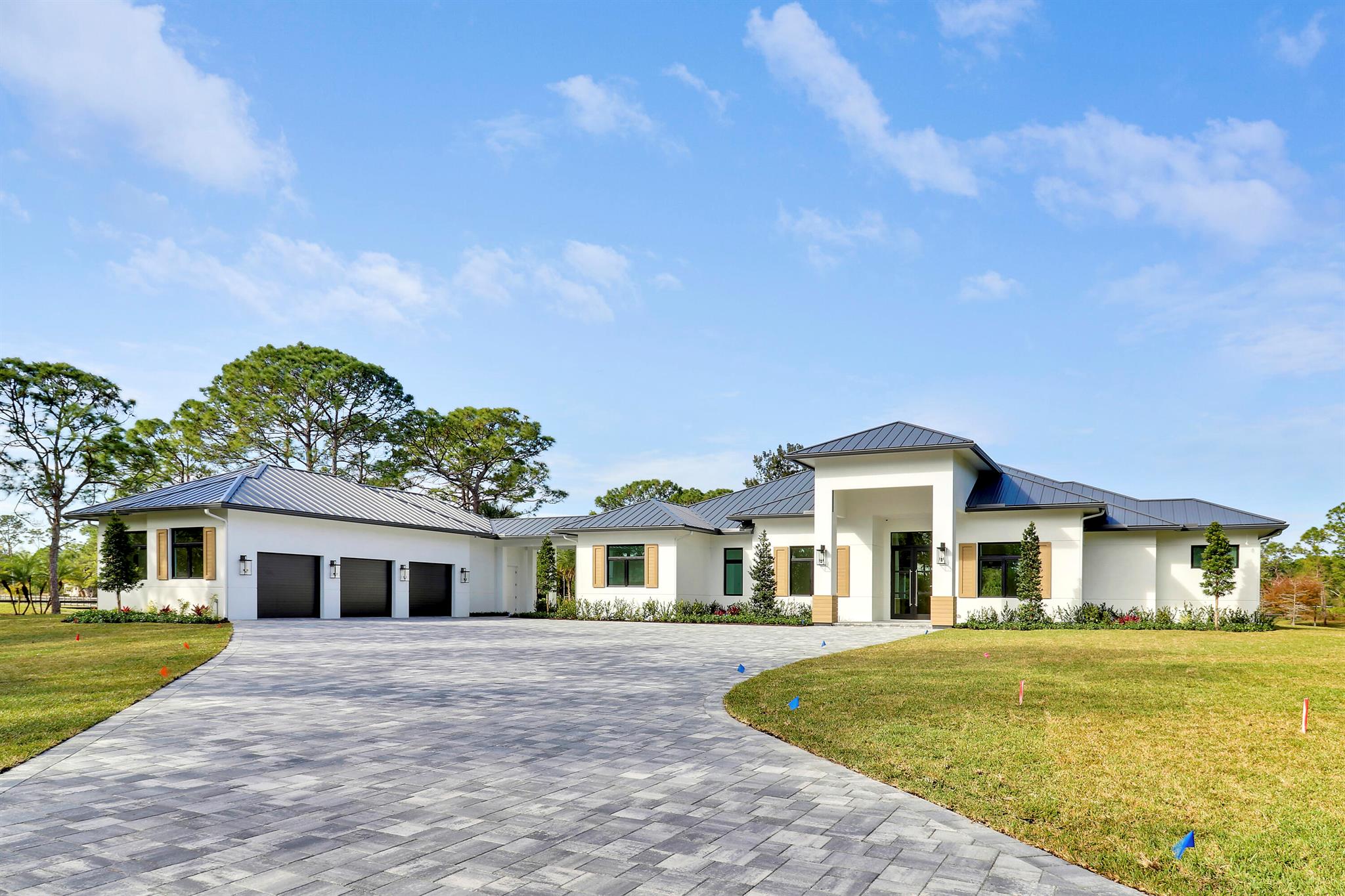 Oversized 6.52 acre lot in the beautiful equestrian community of Caloosa. This new masterpiece of superior workmanship is the distinctive home for the most distinctive buyer. Four bedrooms, four full baths and a half bath. Media room, office, morning room, summer kitchen and breezeway to the 1324 sq ft garage with 4 doors. Garage was designed for adding 4 car lifts. Whole house reverse osmosis system, Thermador appliances, buried propane tank, spray icynene insulation, tongue and groove wood patio ceilings, and three board perimeter fencing. Spanning over almost 5000 sq ft of air conditioned perfection and almost 8000 total square feet. Caloosa features an equestrian center with jumping rings and paddocks plus riding trails through the community.