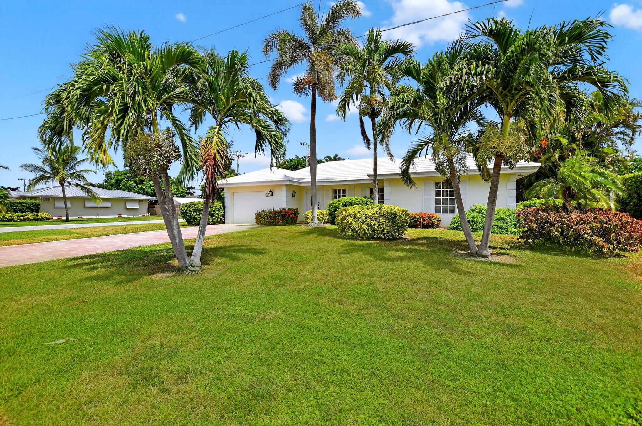****OPEN HOUSE SUNDAY AUGUST 23rd 12-3!!**** Step into PURE CHARM with this beautifully maintained two-bedroom corner-lot pool home, surrounded by lush tropical landscaping that sets the tone for a serene retreat. Nestled in one of the area's most desired neighborhoods, beautiful Paradise Palms. From the moment you arrive, the curb appeal shines-mature palm trees and vibrant greenery create a warm, welcoming entrance. Inside, the home feels light, bright and airy, with soft neutral tones, pastels and white brick, which compliments the natural sunlight pouring in through the elegant plantation shutters and sliding glass doors.