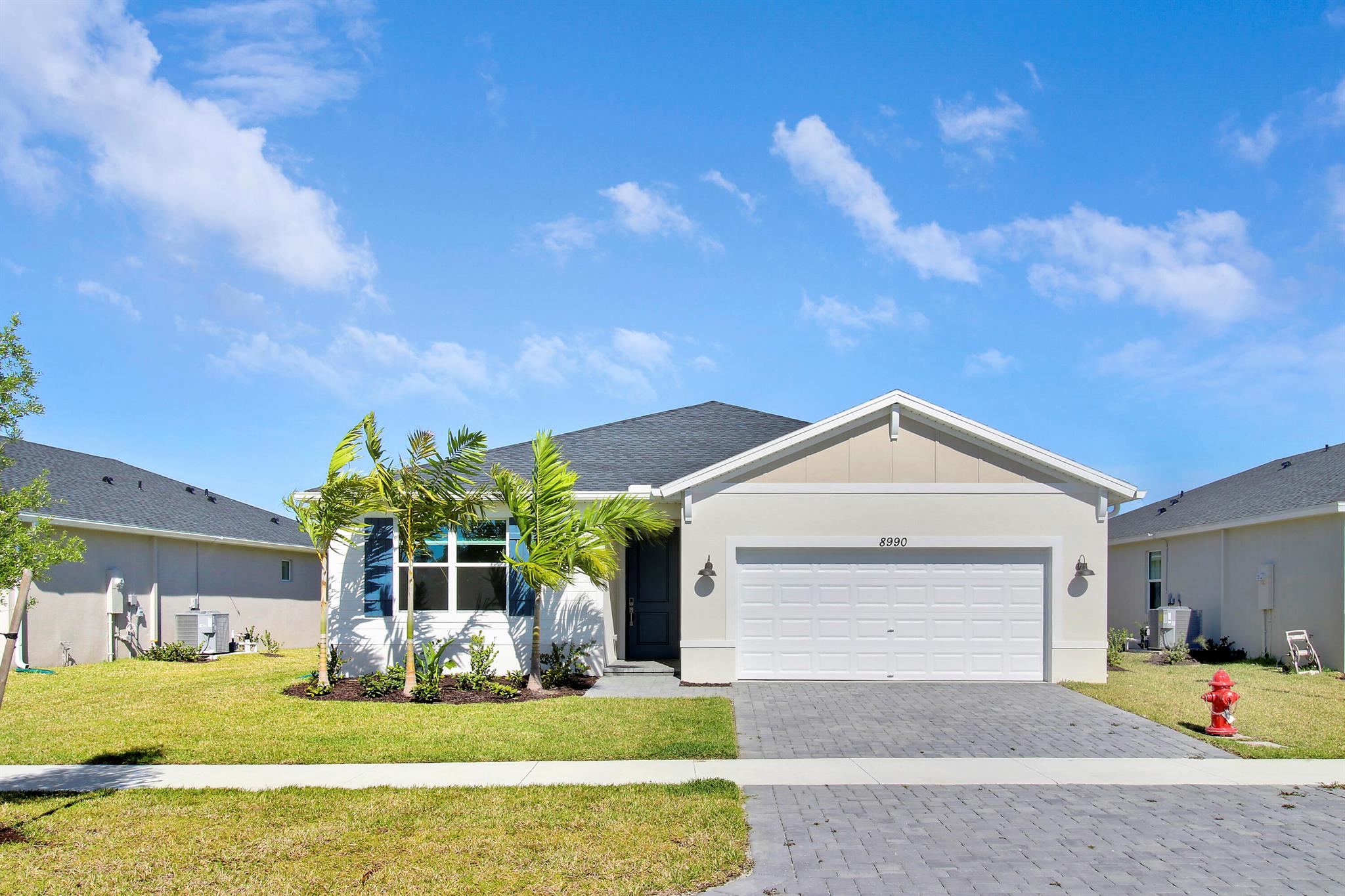 Beautiful 4-Bedroom, 3-Bathroom Lakeview Home.Experience modern living in this stunning, energy-efficient 4-bedroom, 3-bathroom home in a gated, brand-new community of just 99 exclusive homes. This home features impact windows, a spacious two-car garage, and advanced smart home security for ultimate comfort and peace of mind.The open-concept design seamlessly connects the gourmet kitchen to the living and dining areas, creating the perfect space for family gatherings and entertaining. Enjoy serene lake views while being just minutes from I-95, offering easy access to major highways.Located near Tradition, with top dining, shopping, and entertainment options. Monthly rent includes landscaping.