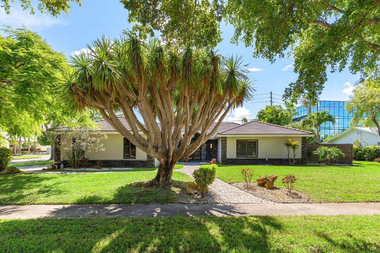Extensively renovated home with redesigned exterior, added interior enclosure & bath, pool remodel, pavers, new fence, faux-finish garage door, tile floors, crown molding & oversized baseboards. Master suite features tray ceiling, walk-in closet & updated bath. Hurricane-impact windows/doors & garage door. Custom TV enclosure, retractable shades & garage shelving. Major upgrades include epoxy-lined water lines & new gas line for whole-home generator. Systems: 4-ton AC (2021), 1.5-ton AC (2018), water heater (2020), pool heater (2021), pool pump recently replaced.The perfect family home!