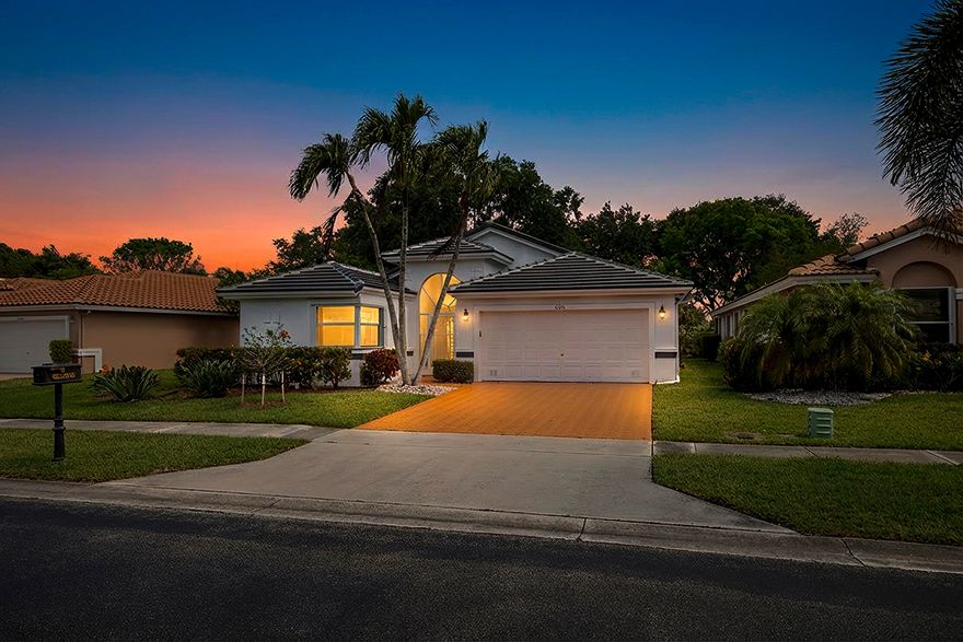 Welcome to this beautifully updated 3-bedroom, 2-bath custom-designed home in the highly desirable active adult living community of Coral Lakes in Boynton Beach. This move-in-ready residence features a brand-new roof and exterior painting (2025). Tasteful, modern renovations throughout create a low-maintenance lifestyle in a resort-style setting. The open-concept layout provides a spacious living and dining area highlighted by elegant chandeliers and abundant natural light. The gourmet kitchen is fully equipped with new appliances, granite countertops, a breakfast bar, and ample cabinetry. Stunning porcelain tile flooring flows through the main living areas, while the two bedrooms feature warm wood flooring. Both bathrooms are stylishly renovated with designer finishes,