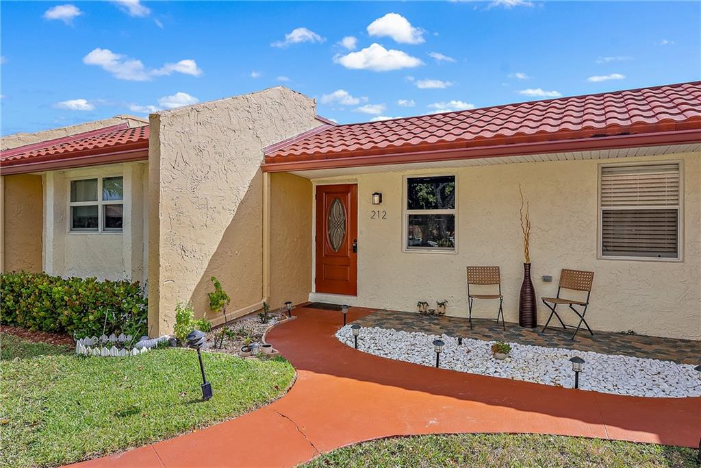 Seller Motivated! This completely renovated ground floor villa overlooking the lake is ready for its next owner! The seller spared no expense, stunning open kitchen with white cabinets to the ceiling, pantry with pull out drawers, granite countertops, stainless steel appliances & beautiful view of the lake from the living area & primary bedroom. Both bathrooms fully renovated from top to bottom one with a walk-in shower the second with a Jacuzzi tub & shower. Partial Impact windows & front door Impact, large white marble look tile throughout, LED lights, crown molding & no popcorn here! Newer All-In-One Washer/Dryer in unit. Golden Lakes offers clubhouse, large pool, spa, tennis, shuffleboard & more for active seniors. Bus service to shopping & medical plazas. Roof 2010, A/C approx 5-6 yr