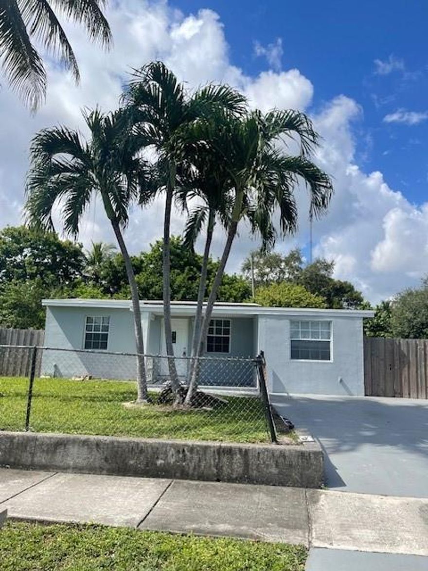 Beautiful single-family home. Features 3 bedrooms 2 bathrooms with an open layout. New paint, kitchen has granite counter tops and white appliances, laundry room, tile flooring, updated bathrooms, and walk-in closets. Large, fenced back & front yard. Pets welcomed with refundable deposit. Located right on the county line between Broward and Dade County. Close to shopping plazas and large variety of restaurants.