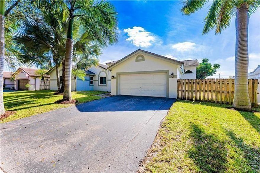 NO HOA! This beautifully remodeled 4-bedroom, 3-bath pool home, 2-car garage fenced yard is located in the highly sought-after Royal Palm South neighborhood. The home features an open floor plan, modern tile flooring, soaring ceilings, stainless kitchen appliances, and impact windows with ARGON insulation. A standout feature is the private in-law suite with its own entrance and studio kitchen—perfect for extended family and guests. Prime location: near major highways, Costco, top retail stores, universities, world-class medical facilities, public transportation, and grocery stores. Zoned for highly rated schools. This home truly has it all—style, function, and location! Inside of home being painted, new AC installed, new closet system being installed in main bedroom walk-in closet.