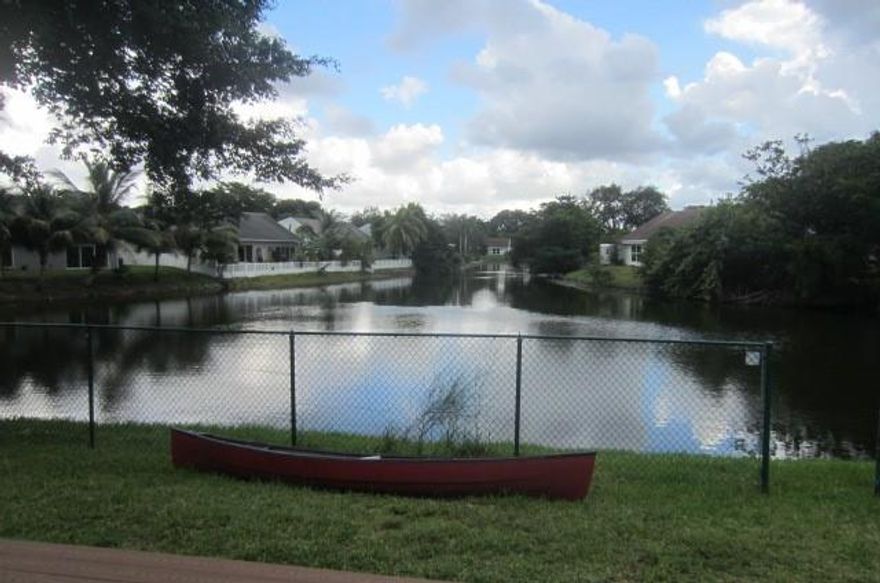 4 Bedroom / 2 Bath w/ 1903 SF. Base - plus Loft; 2 car garage [storage - music studio] [not in living area]. w/ Garage door and side entry door. Secluded in back end of Subdivision w/ limited traffic. Recently permitted [2025] environmental seawall on Lake. Permitted Impact Glass all windows; Permitted Extra wide - Stamped Concrete driveway. Most recent Roof in 2016. Permitted Rear Deck w/ composite wood look; Side fence [wood] permitted; Rear c/L fence permitted; Granite Counters, Stainless Refrigerator and Glass top Stove, Ceramic Tile in Living Room, Family areas, hallways; and kitchen is commercial quality and NOT rectangular shaped. New Laminate in loft area; Enhanced environmental seawall in rear. Everything completed with final inspections.
