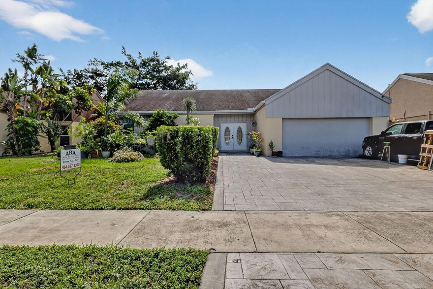 4 Bedroom / 2 Bath w/ 1903 SF. Base - plus Loft; 2 car garage [storage - music studio] [not in living area]. w/ Garage door and side entry door. Secluded in back end of Subdivision w/ limited traffic. Recently permitted [2025] environmental seawall on Lake. Permitted Impact Glass all windows; Permitted Extra wide - Stamped Concrete driveway. Most recent Roof in 2016. Permitted Rear Deck w/ composite wood look; Side fence [wood] permitted; Rear c/L fence permitted; Granite Counters, Stainless Refrigerator and Glass top Stove, Ceramic Tile in Living Room, Family areas, hallways; and kitchen is commercial quality and NOT rectangular shaped. New Laminate in loft area; Enhanced environmental seawall in rear. Everything completed with final inspections.