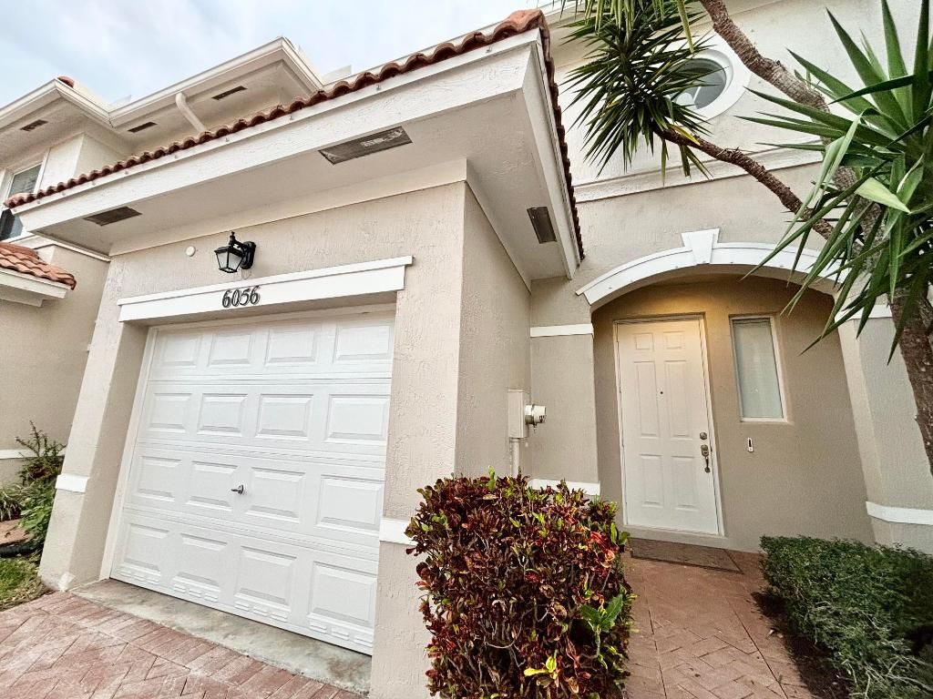 Photo of 6056 Seminole Gardens Circle, Riviera Beach, FL 33418 (MLS # R10980497)