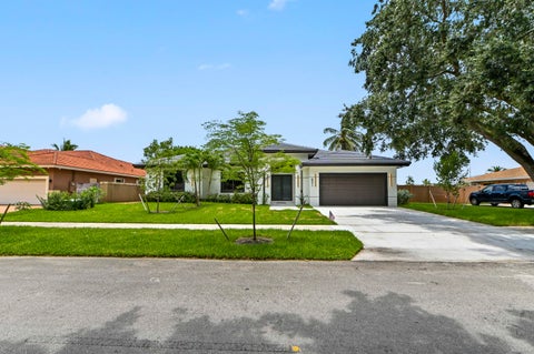 Photo of 621 NW 42nd Avenue, Coconut Creek, FL 33066 (MLS # B26049802)