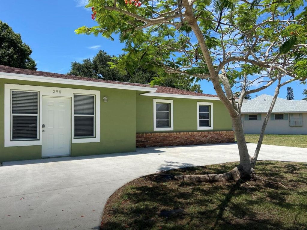 Photo of 298 NE Surrey Street, Port St Lucie, FL 34983 (MLS # R10892871)