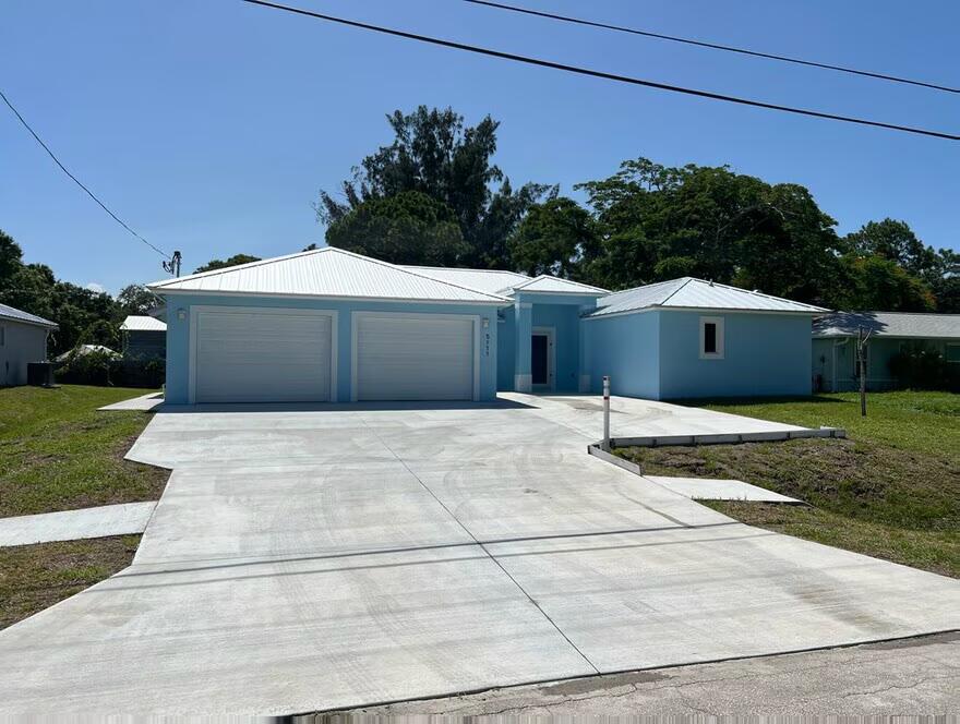 TWO HOUSES IN ONE!!!!! The MAIN house includes 3 bedrooms, 2 bathrooms, a spacious living area, fully equipped kitchen, and laundry room. Additionally, there is a separate IN-LAW SUITE with 2 bedrooms, 1 bathroom, its own kitchen, and laundry, providing extra space for family members or guests. Both units are equipped with independent central air conditioning systems, ensuring a comfortable atmosphere year-round. The property is ideally located near the Intracoastal Waterway, offering a serene environment. 3 Bedrooms, 2 Bathrooms (Main House) 2 Bedrooms, 1 Bathroom (In-Law Suite) Metal roof, impact windows and doors Independent central air conditioning in each unit. A must-see home. schedule today !!!!