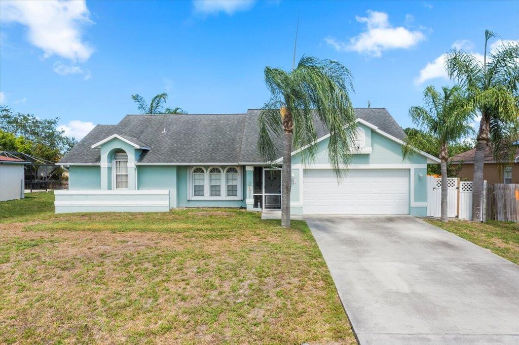 Photo of 4565 SW Floral Street, Port Saint Lucie, FL 34953 (MLS # R10990359)