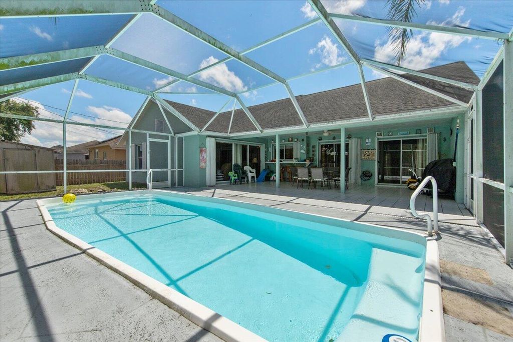 Photo of 4565 SW Floral Street, Port Saint Lucie, FL 34953 (MLS # R10990359)