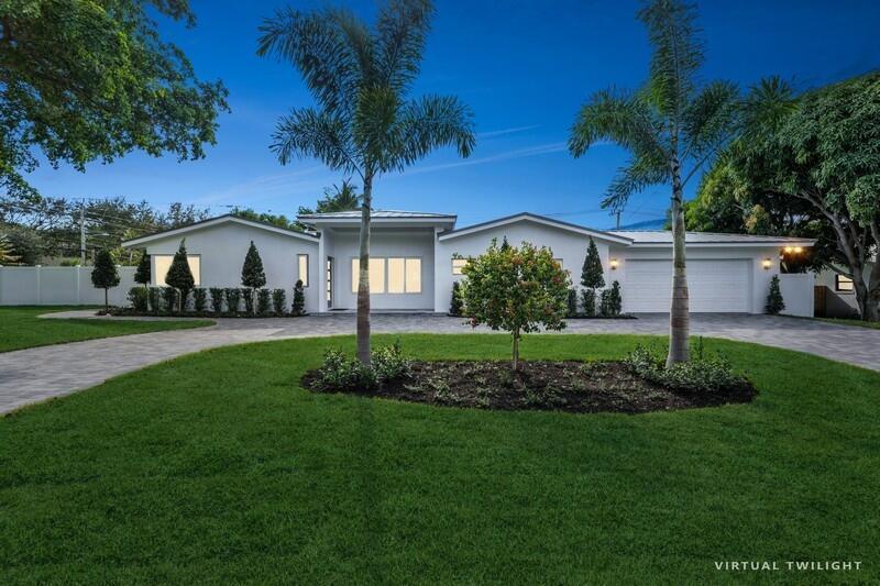 Perched on nearly 1/2 an acre, this double-lot, new construction waterfront property truly has it all. As you walk into the stunning home you are immediately struck by the vaulted knotty pine ceilings accentuating the open and bright layout. The gorgeous chef's kitchen boasts an oversized island, quartzite countertops, custom cabinetry, and high-end stainless steel appliances. The enormous master suite is located in its own wing and includes two massive walk in closets, a seating area, and a spectacular bath complete with wet room, custom double vanity, and soaking tub. The three way split floorpan allows for extra privacy with a VIP suite separate from the other bedrooms, as well as two guest rooms at the other end of the home. All guest rooms are generously sized with gracious closets