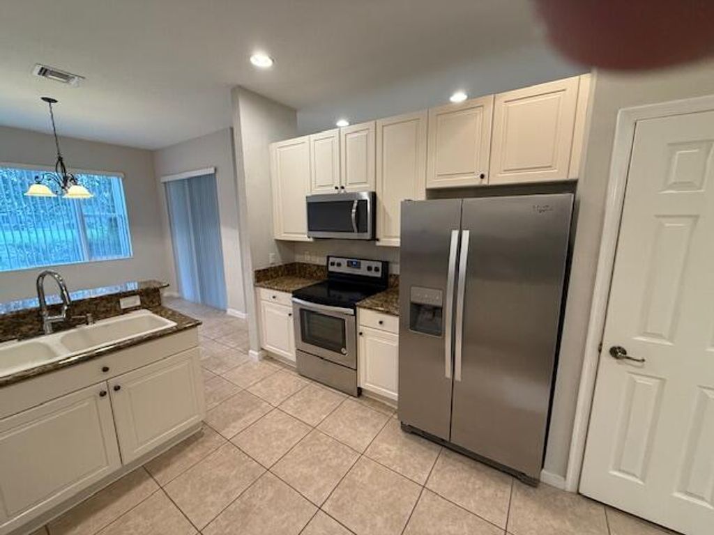 Photo of 2210 SW Portsmouth Lane, Port Saint Lucie, FL 34953 (MLS # R11030291)