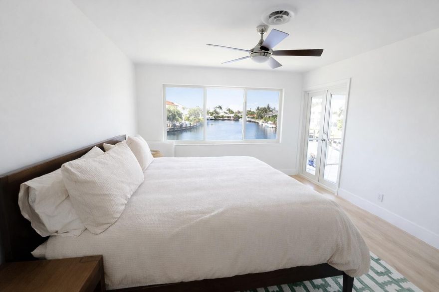 Newly updated bright and spacious 2-bed, 2-bath condo in the boutique 12-unit Gardenia Terrace offers stunning water views from the moment you enter. The living room, kitchen, and primary bedroom all offer unobstructed canal views. Impact windows and doors, Large screened porch overlooking the canal, perfect for relaxing and enjoying your morning coffee. The open kitchen showcases granite countertops, stainless-steel appliances, and island seating. Elegant finishes throughout include wall & ceiling skimming, fresh paint, matching luxury vinyl plank flooring with new baseboards, impact-grade windows & doors, updated fans and outlets. This unit blends waterfront serenity with thoughtful upgrades and abundant natural light. Dockage available for rent. Ocean access with no fixed bridges.