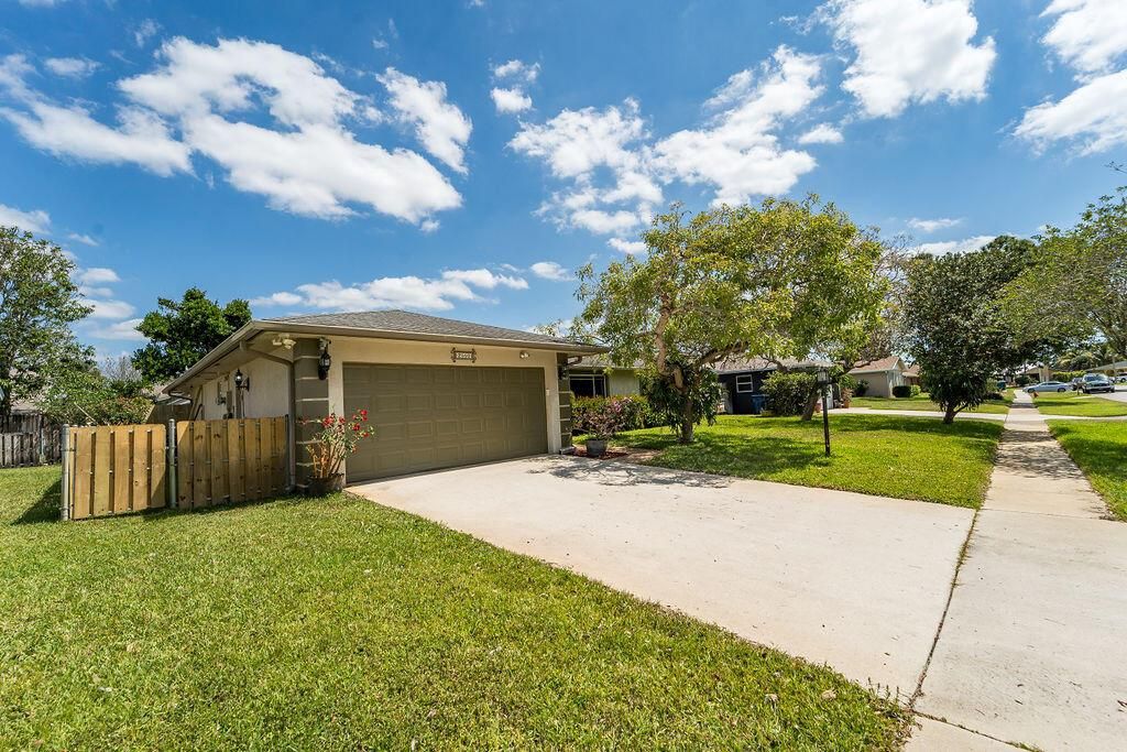Photo of 2550 Lochmore Road, Riviera Beach, FL 33407 (MLS # R11082297)
