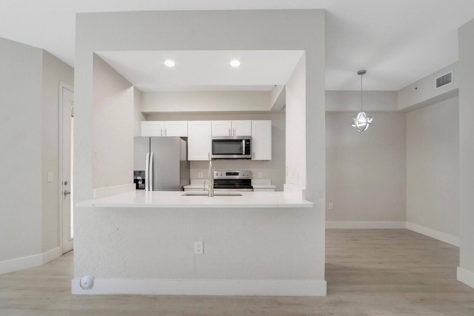 Residences At Legacy Place. Resort Style 1 Bedroom Fully Remodeled. Luxury Vinyl Flooring Throughout. Quartz Counter Tops, Stainless Appliances & Custom Lighting. Must See!