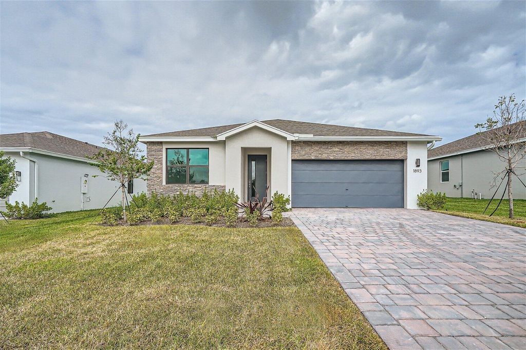 Photo of 1893 NE Ocean Dunes Drive, Jensen Beach, FL 34957 (MLS # R10935552)