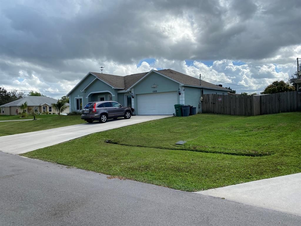 Photo of 1202 SW Albenga Avenue, Port Saint Lucie, FL 34953 (MLS # R10694314)