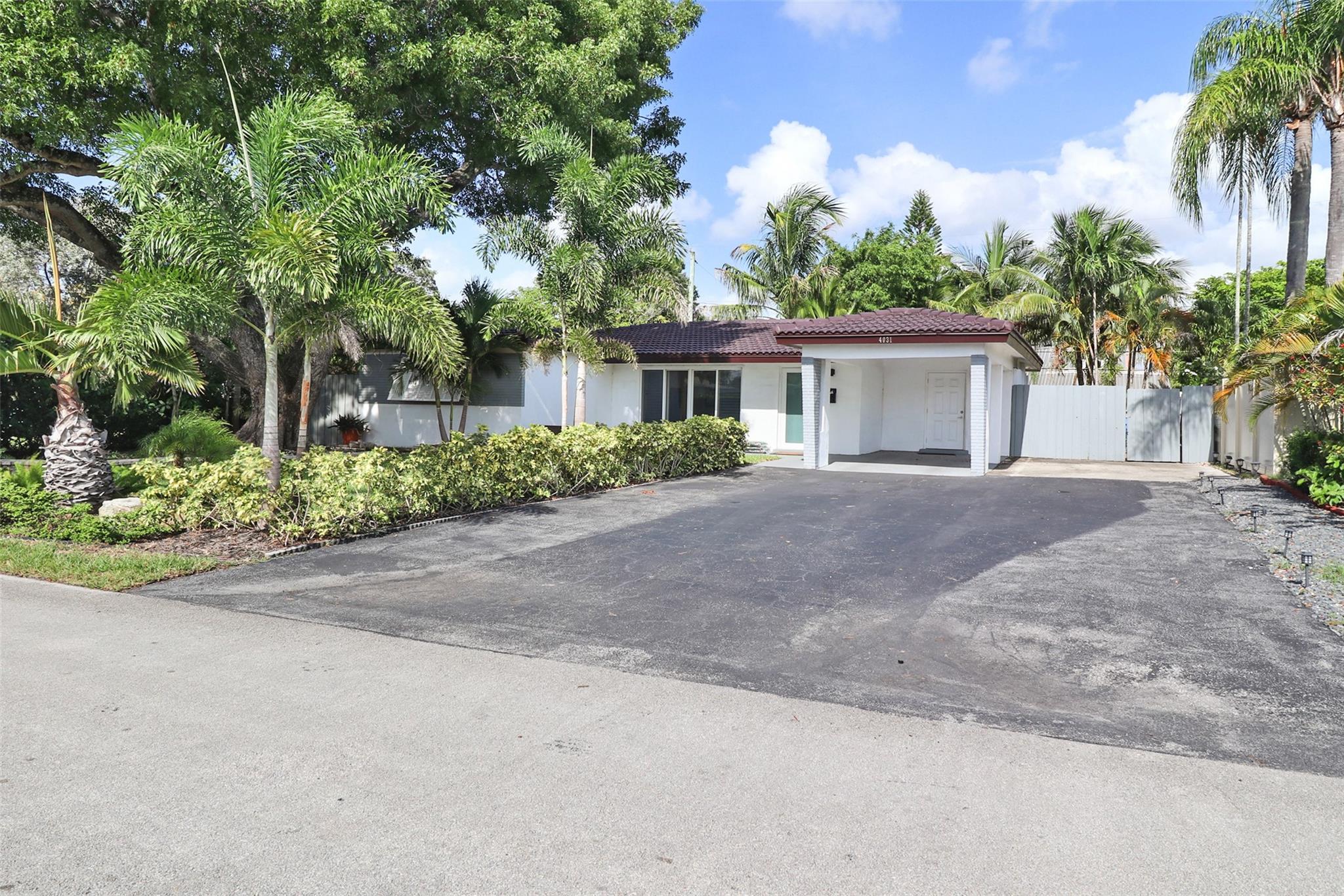 Welcome to your new home in the sought-after Coral Heights neighborhood! Charming and spacious single-family residence offers 3 bedrooms, 2 full bathrooms, and plenty of indoor and outdoor living space, perfect for families and pet lovers alike. Step inside to a bright and inviting open-concept living area, neutral tile flooring, and large windows that bring in natural light. Additional features include: screened-in porch, large, fully fenced backyard providing tons of space for children and pets, Split-bedroom layout, Covered carport, ample driveway parking, Pet-friendly, Washer/dryer included! Located in a quiet, tree-lined neighborhood, minutes from the beach, downtown Oakland Park, tons of shops! Don't miss this rare rental opportunity in one of the most beloved neighborhoods. No HOA!