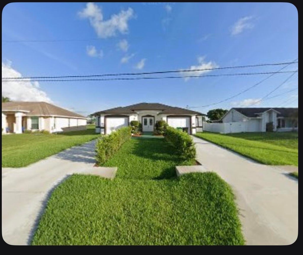 Photo of 220 SW Ridgecrest Drive, Port Saint Lucie, FL 34953 (MLS # B26036685)
