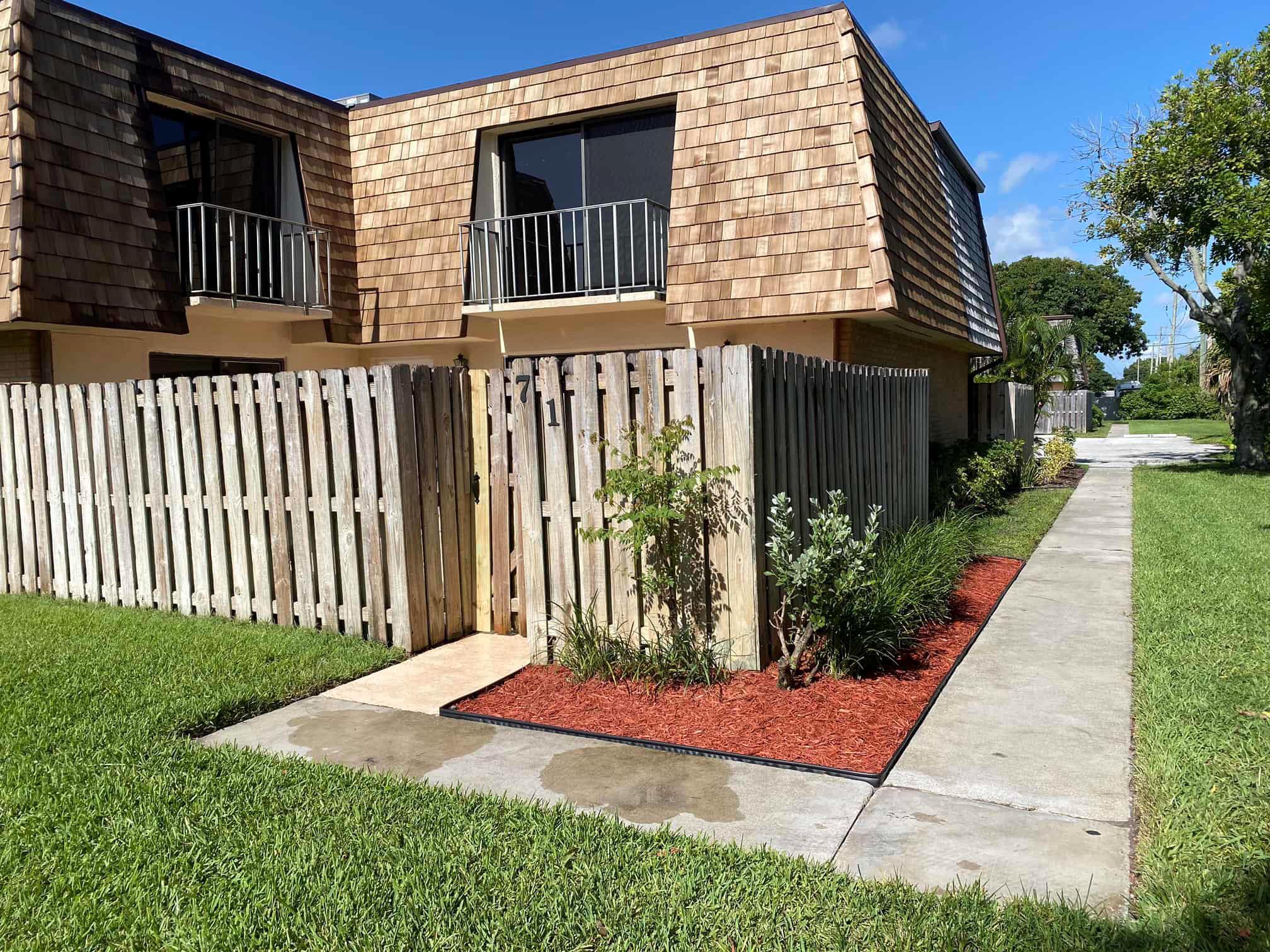 Welcome to this inviting 2-bedroom, 2-bath Courtyard Townhouse, ready for you to move in! This charming home boasts brand-new high-quality vinyl flooring in the bedrooms, a new roof, and a fresh coat of paint throughout. Enjoy the spacious patio and fenced yard, perfect for relaxation or entertaining in a community that's dog-friendly. With two assigned parking spaces and additional guest parking, convenience is at your doorstep. Ideally located near Publix, a variety of restaurants, shopping, and just minutes from Downtown, the beach, and the airport. Don't miss out on this fantastic opportunity!