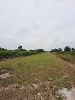 located just off main ATV trail with a neighbor behind and down the street
