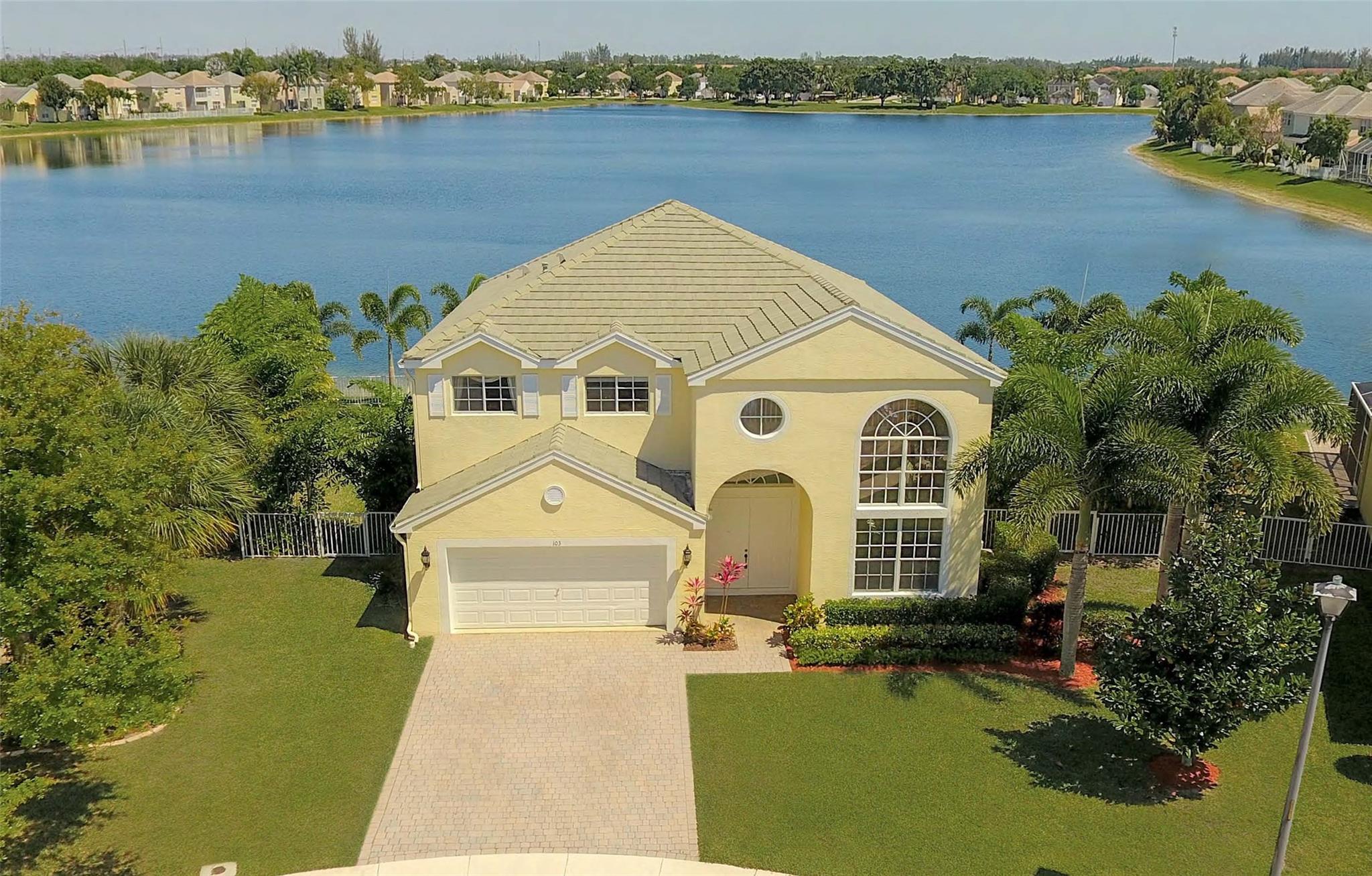 Beautifully renovated 4 bedroom house on oversized cul-de-sac lot with huge lake views. Covered screened porch and fenced in yard. Quartz countertops in kitchen and bathrooms. Great multi-functional layout with numerous built-in cabinets. Great community amenities and very close to shopping.