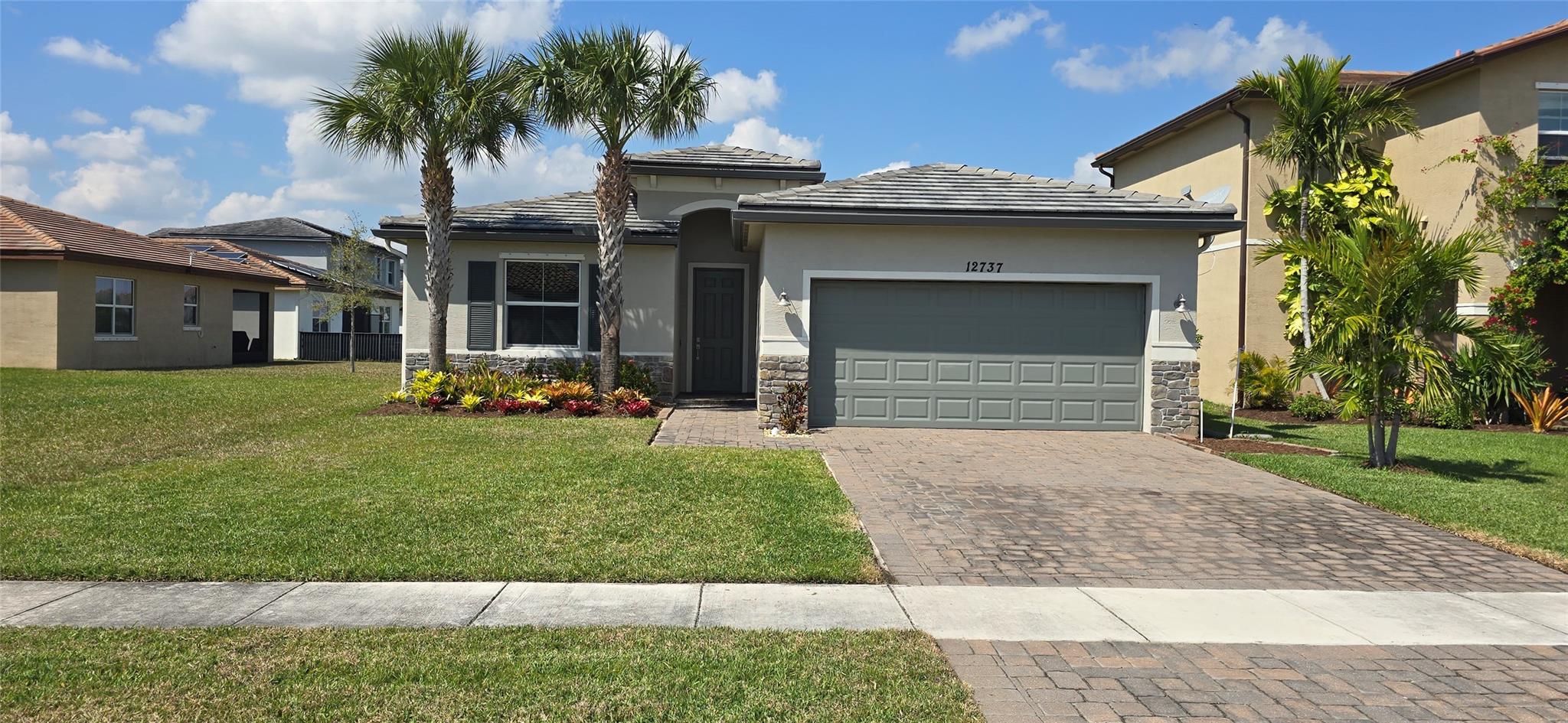 Welcome to this charming single-family Smart home nestled in the desirable family friendly Copper Creek community. Built in 2018, this well-maintained residence offers 3 spacious bedrooms and 2 modern bathrooms across 1,649 square feet of comfortable living space. The open-concept floor plan seamlessly connects the living, dining, and kitchen areas, creating an inviting atmosphere perfect for both entertaining and everyday living. The kitchen boasts 42" cabinets, stainless steel appliances, quartz countertops and ample storage. Relax outside and enjoy the lake view from the screen enclosed lanai. All bedrooms have luxury vinyl flooring. No smoking, no pets allowed. Agent owner.