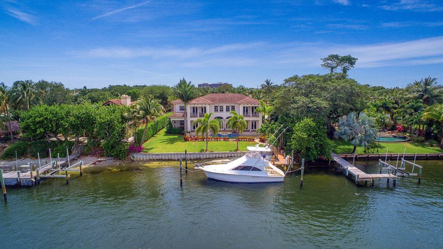 Custom estate home with 110' of frontage on the Intracoastal and a 6 car garage. This home features marble and wood floors, volume ceilings, a large kitchen with top of the line appliances, large dining room, spacious media/theater with seating and 7 point speaker system and a climate controlled 660 bottle wine room. Other features include a heated pool/hot tub with expansive deck, a gated circular driveway with motor courtyard, newer seawall and dock with power pedestal and a 45KW whole house generator.