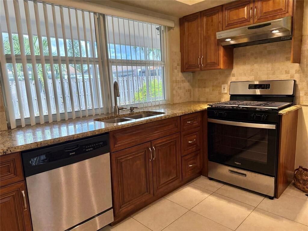 Photo of 11741 NW 30th Place, Sunrise, FL 33323 (MLS # B26009554)